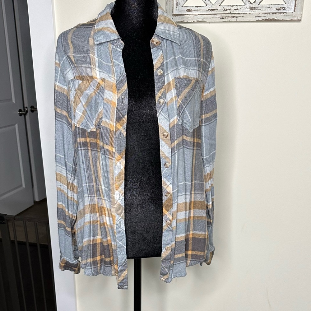 Plaid button down shirt.